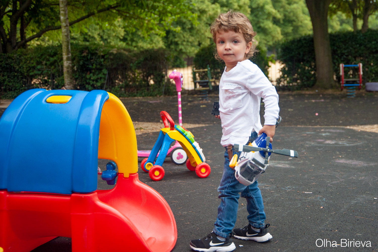 Little boy with toy helicopter